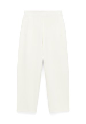 Pantalon large couleur crème en tissu doux, doté de deux poches latérales et d'une ceinture lisse, avec une coupe ajustée.