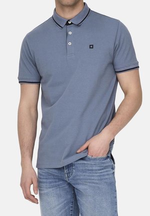 Light blue polo shirt with a collar, featuring a two-button placket, black trim on the collar and sleeves, and a small logo on the chest.