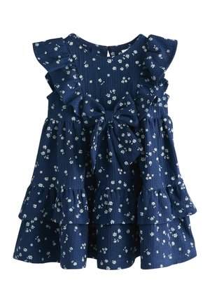 Vestito senza maniche blu navy con stampa di margherite bianche, spalle arricciate, gonna a balze e grande fiocco annodato in vita.