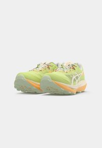 Lightweight running shoes in vibrant green with orange accents. Synthetic upper with a textured sole and contrasting laces.