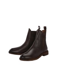Bottines en cuir brun avec des panneaux latéraux élastiques, une languette de tirage, des accents texturés et une forme de pied légèrement allongée.