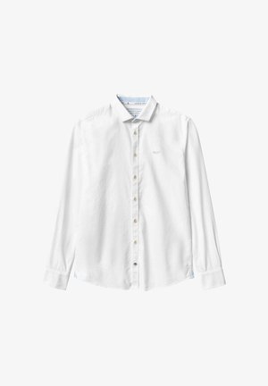 Chemise blanche à manches longues en coton avec un col boutonné, dotée de boutons en bois et d'ores de côté pour plus de liberté de mouvement.