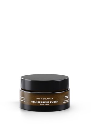 Transparent setting powder in a round, black jar with a matte finish. Label features white text and brown accents. Sleek design.