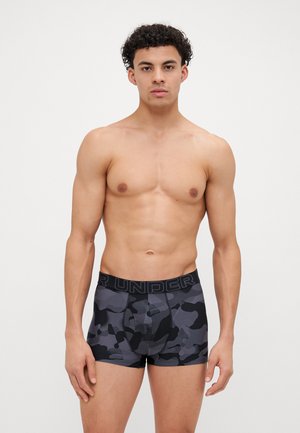 Black and gray camo boxer shorts with a black waistband displaying "UNDER". The fabric appears smooth with a fitted cut.
