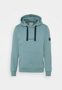 Light blue hoodie made from soft fabric featuring a front pocket, drawstring hood, and black logo text. Includes ribbed cuffs and hem.