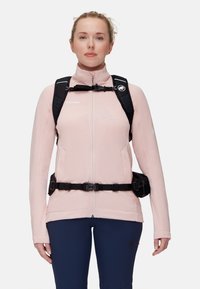 Ljusrosa zip-up jacka med svarta selar, som har två sidofickor och en strukturerad yta. Svart midja för säker passform.
