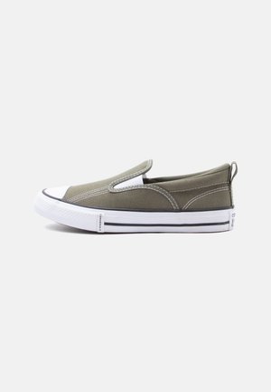 Olive green slip-on canvas sneaker with white rubber toe cap and sole, featuring black stripe and pull tab at heel.