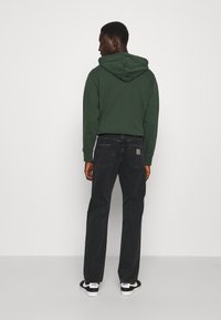 Carhartt WIP PONTIAC PANT MAITLAND - Straight leg jeans - black stone washed