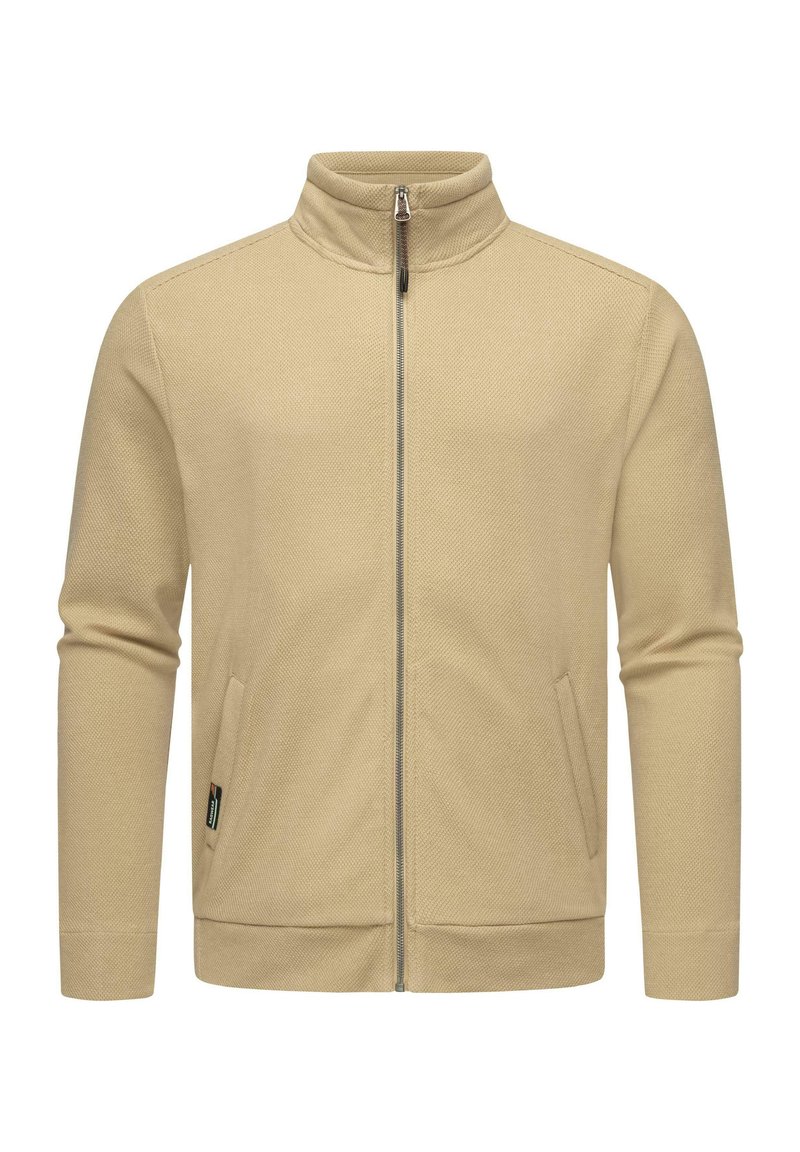 Giacca beige con zip, colletto alto, tasche laterali, tessuto testurizzato e design aderente, caratterizzata da una zip argentata e una branding minimale.