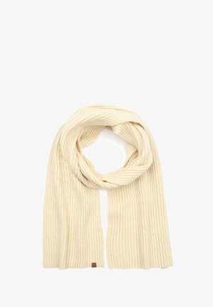 Gerippter cremefarbener Schal aus weichem Material, mit einem gefalteten Design und einem kleinen braunen Etikett an einem Ende.