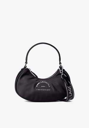 Must mustaga musta, millel on kaarjas kuju, valge logo, hõbedane metallist riistvara ja eemaldatav rihm logo detailidega.