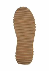 Gummisula med en tan-färg, med ribbad textur och vågmönster för förbättrat grepp och hållbarhet.
