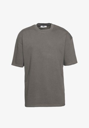 T-shirt grigio a maniche corte in cotone testurizzato, con scollatura rotonda e spacchi laterali per una vestibilità rilassata.