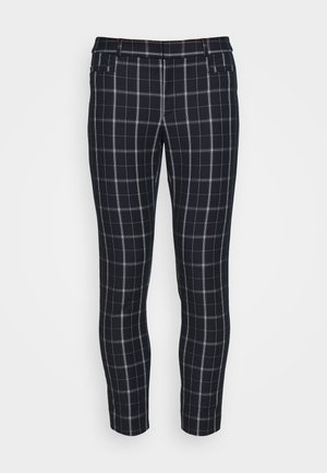 Pantalon noir slim à motif à carreaux fenêtre blanc avec poches avant, présenté sur fond blanc.