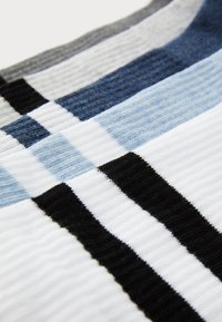 Striped textile featuring alternating colors of white, black, dark blue, light blue, and grey, with a ribbed texture and horizontal pattern.