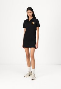 Black polo dress with short sleeves, featuring an embroidered NY logo in orange and floral accents. Made of smooth cotton fabric.