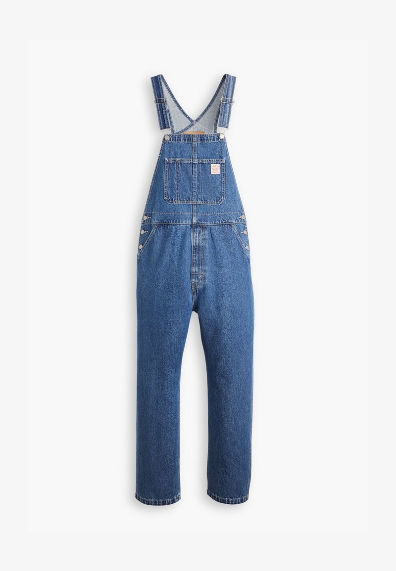 Salopette in denim di un blu medio, con spalline regolabili, una tasca anteriore e dettagli in metallo, caratterizzate da una vestibilità comoda e un taglio dritto.