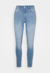 Svetle modré skinny džíny vyrobené z denimu s vysokým pasem. Mají přední zapínání na knoflík, pět kapsový design a vybledlý vzhled.