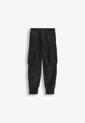 Czarne spodnie typu cargo z elastycznym pasem i mankietami, z zapięciem na sznurek i kieszeniami z patkami na obu udach.