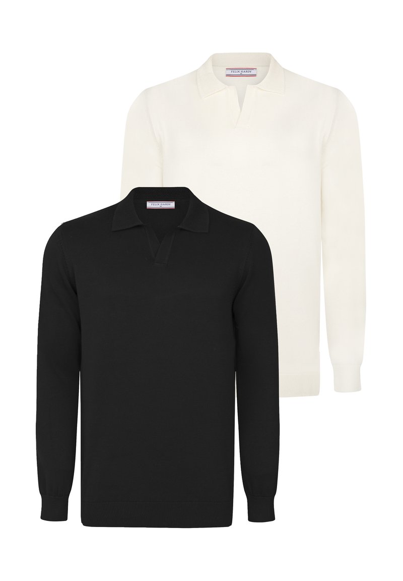 Kaks pikka varrukat polo särki: üks must ja üks valge. Pehme kudum, klassikaline krae nööbiga kaela juures, soonikkoes mansetid ja allääred.