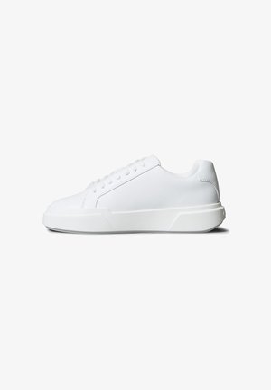 Low-top white leather sneaker with lace-up closure and thick sole, shown from right side on a white background.