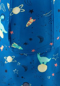 Blue fabric featuring space-themed patterns with rockets, planets, stars, and a dinosaur, showcasing vibrant colors and playful designs.