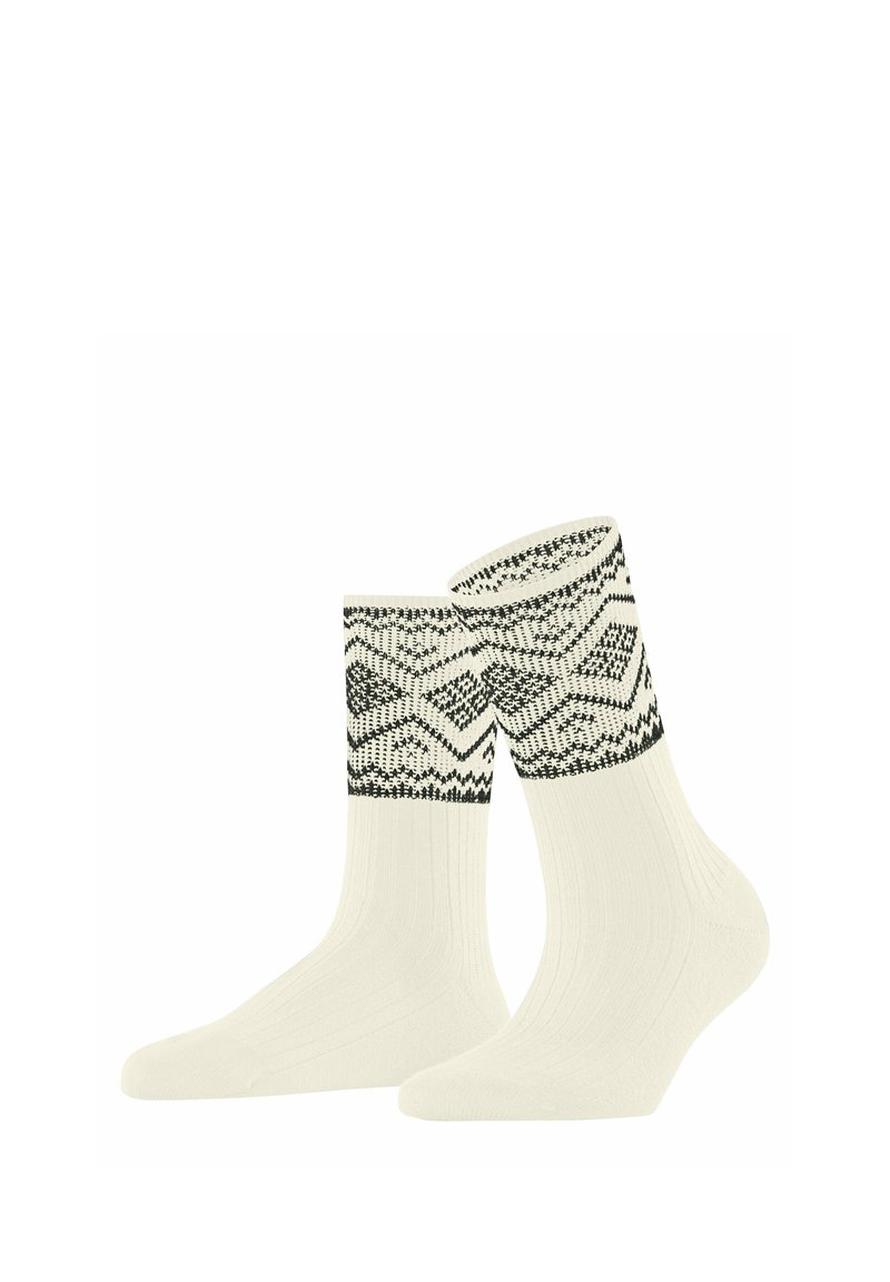 Gestrickte Socken in Creme mit schwarzen geometrischen Mustern am Bündchen. Weiches Material, gerippte Struktur und bequemer Sitz.