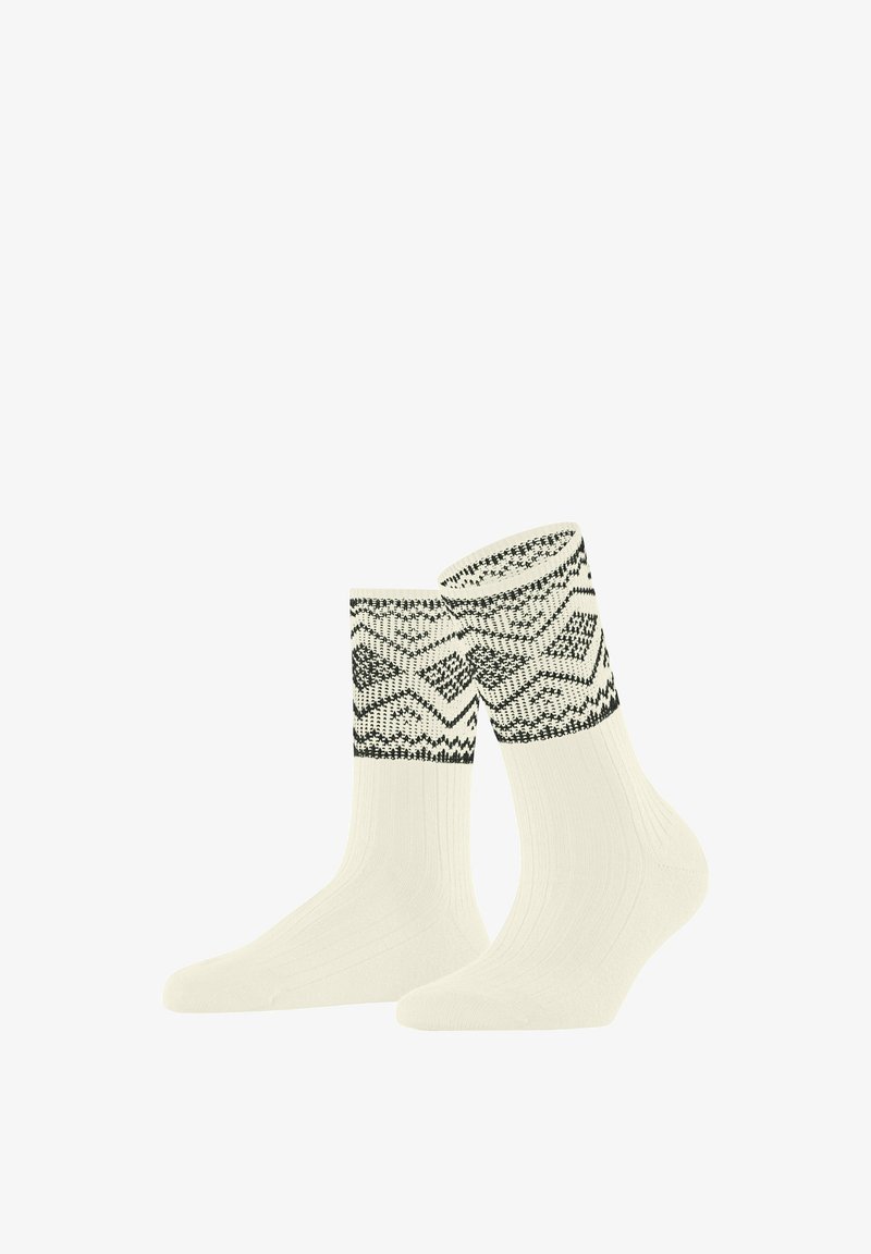 Gestrickte Socken in Creme mit schwarzen geometrischen Mustern am Bündchen. Weiches Material, gerippte Struktur und bequemer Sitz.