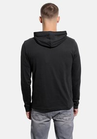 Black long-sleeve hoodie with a drawstring hood, featuring a smooth texture. The back is plain with a slightly curved hem and casual fit.