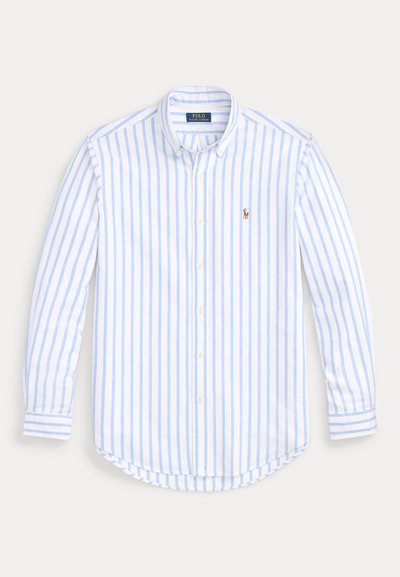 Light blue and white striped long-sleeve button-down shirt. Soft fabric with a rounded hem, featuring a small logo accent on the chest.