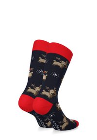 Skarpety dziane z granatową bazą, czerwonymi mankietami i piętą. Wzór z reniferami i płatkami śniegu. Materiał jest miękki i elastyczny.