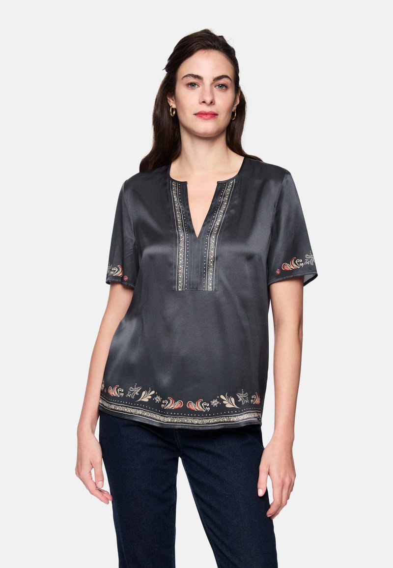 Dark gray short-sleeve blouse with a V-neck, featuring intricate floral embroidery at the hem and elegant textured detailing on the neckline.