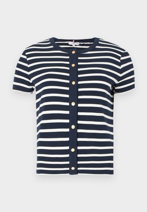 Navy and white striped short-sleeve blouse with a round neckline and buttons down the center. Made of soft fabric with a fitted design.