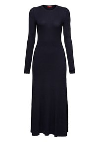 Robe longue noire en maille côtelée avec manches longues et encolure ronde, partie supérieure ajustée et jupe évasée.