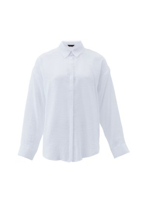 Chemise blanche à manches longues en tissu léger. Elle présente un devant boutonné, un col classique et une coupe ample avec des manches à poignets.