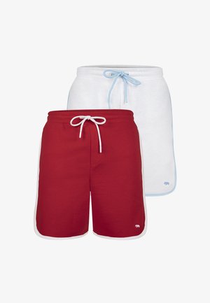 Červené a bílé šortky s elastickým pasem a šňůrkou, které jsou kombinovány se světle modrými a bílými šortkami. Oba kusy mají kontrastní lemy.