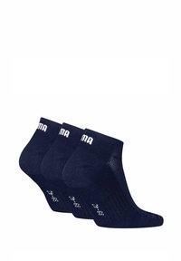 Navig blauwe enkelkousen met een gevarieerd breisel, voorzien van witte logo- en gripdetails. Verkocht in een verpakking van drie.