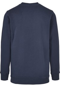 Felpa blu navy a maniche lunghe con scollo rotondo, polsini e orlo a costine, vista da dietro.