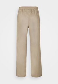 Beige broek met een relaxed fit, elastische tailleband en een gladde textuur. Rechte pijpen en geen zichtbare versieringen of patronen.