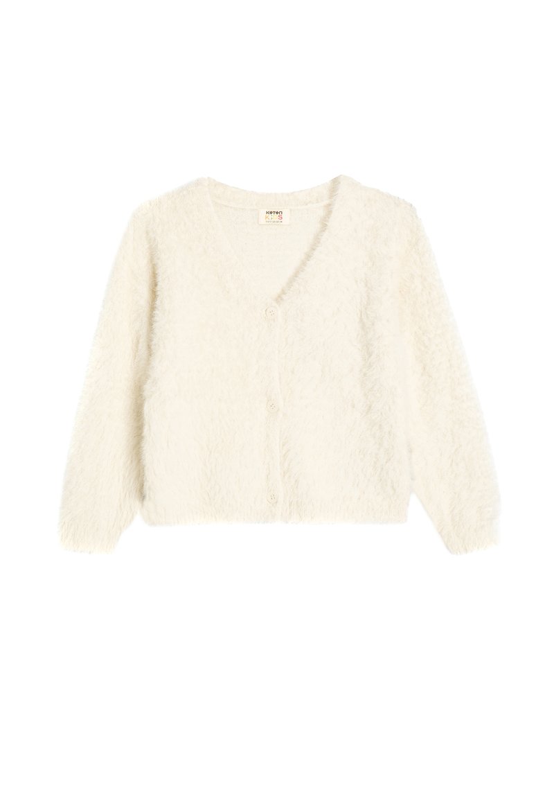 Cardigan bianco fuzzy con scollatura a V, maniche lunghe e tre bottoni sul davanti. Texture morbida e design leggermente cropped.