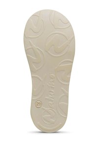 Natuurrubber schoenenzool in lichtbeige. Heeft een gestructureerd oppervlak met een cirkelvormig logo-patroon en "NATURINO" in reliëf, maat 20.