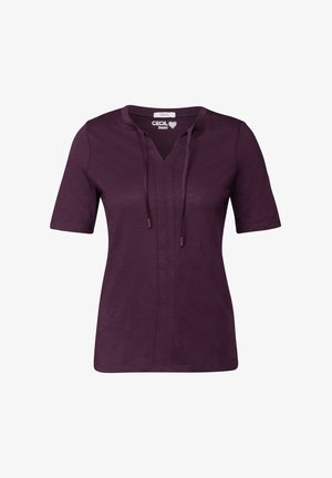 Paarse top met korte mouwen en een V-hals, trekkoorddetail en een relaxte pasvorm. Gemaakt van zachte stof met een subtiele textuur.