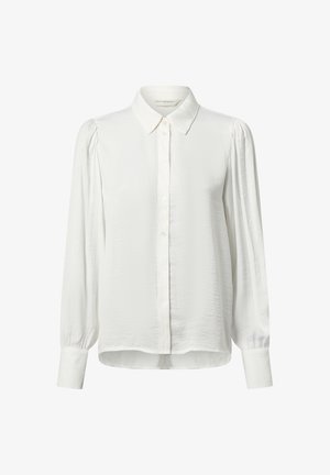 Blouse blanche à manches longues avec devant boutonné, col pointu, fronces légères aux épaules et larges poignets boutonnés.