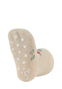 Beige Socken mit weißen Sternen auf der Sohle; mit grünen und roten Blumenakzenten. Aus strapazierfähigem Stoff für Komfort.