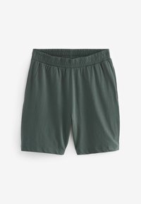 Zöld sportnadrág, elasztikus derékrésszel, sima felülettel és egyenes fazonnal. Nincsenek látható minták vagy fémalkatrészek.