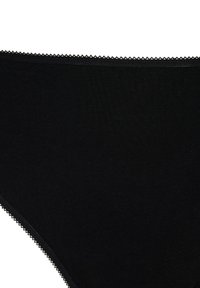 Black cotton brief featuring a smooth texture, classic shape, and delicate scalloped trim along the waistline. Simple and functional design.