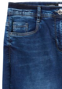 Jean en denim bleu foncé en gros plan montrant la poche avant, la petite poche, la passants de ceinture, les coutures et un bouton métallique.