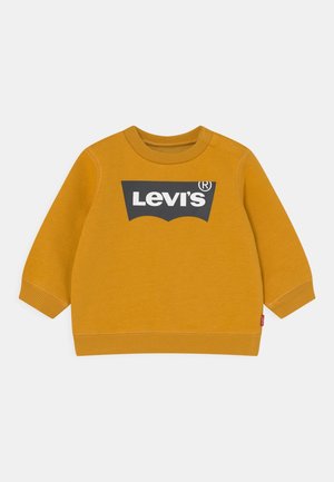 Musztardowożółta bluza dla malucha z długim rękawem i czarnym logo Levi's na piersi.