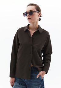 Niet geselecteerd, black olive