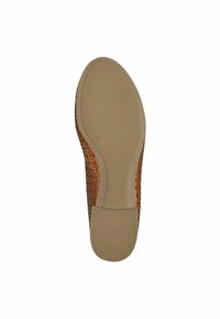 Leather shoe sole featuring a tan-colored rubber bottom, open perforated design, and a slight heel. Size label '37' visible.
